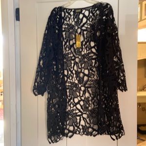 Chic coverlet from Neiman Marcus. Use as swimsuit over up or with white pants!